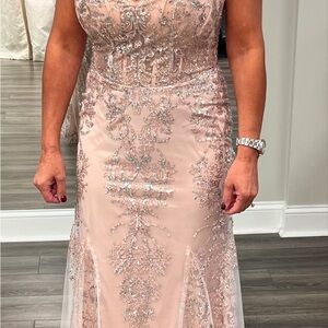 Brand new. Altered but never worn. Size 4/6 after alterations. Blush under tone